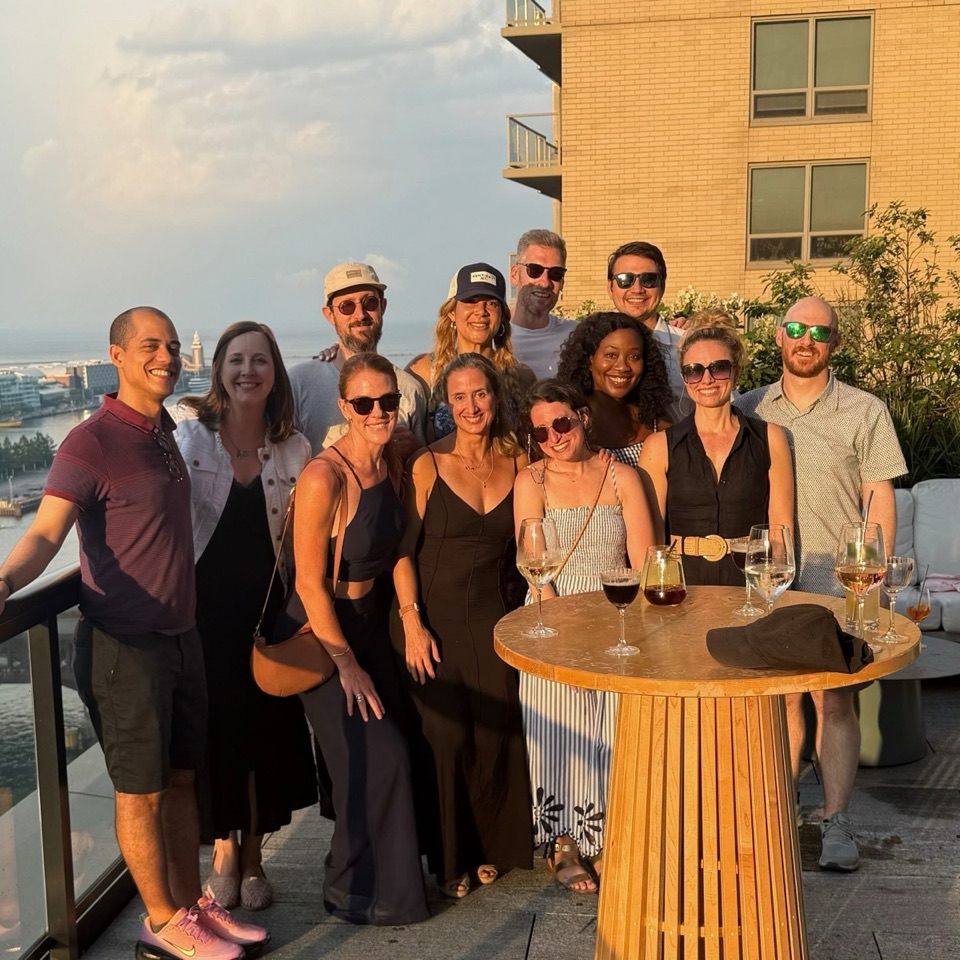 Kauffman Fellows Class 27 gathered on a rooftop terrace at sunset in Chicago